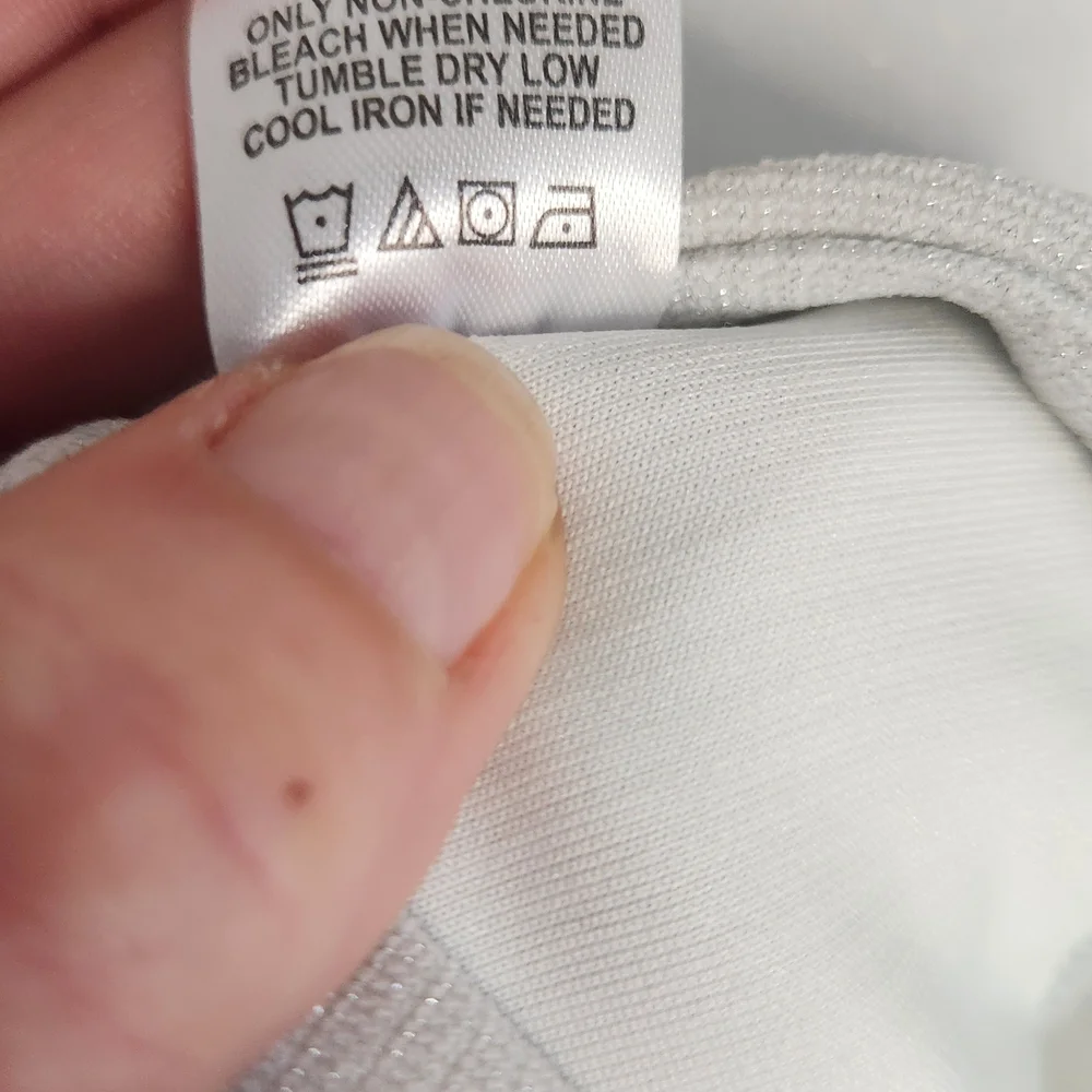 Badgley Mischka White Top with Subtle Metallic Trim - Picture 5 of 9